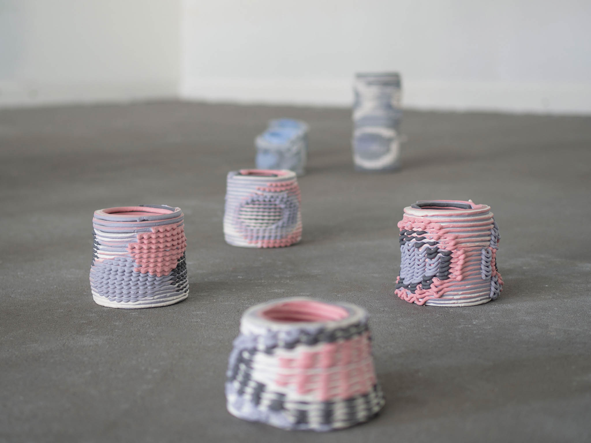 collection of woven ceramic vases